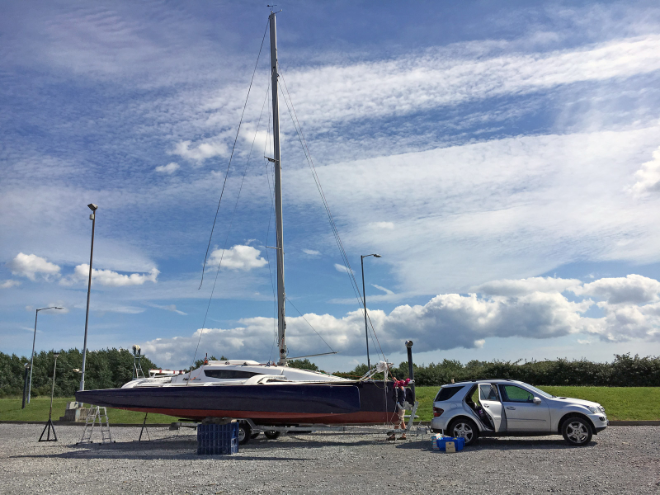 Small boat behind matchbox car